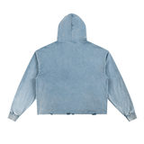 Back view of light blue Vintage Washed Frayed-Hem Hoodie, ideal for layering in street casual fashion.