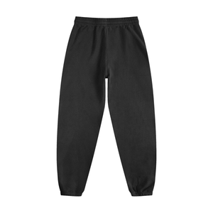Back view of black Vintage Washed Cotton Sweatpants showing elastic waistband and cuffed ankles for a relaxed fit.
