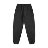 Back view of black Vintage Washed Cotton Sweatpants showing elastic waistband and cuffed ankles for a relaxed fit.