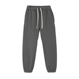 Charcoal Essential Fleece Sweatpants with adjustable drawstring and tapered fit, ideal for unisex loungewear or workouts.
