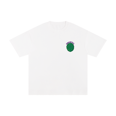Unisex Cotton T-Shirt – Turtle Power in grey with a green turtle shell graphic and 'TURTLE PWR' text on chest. Loose fit, 100% cotton fabric.