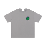 Unisex Cotton T-Shirt – Turtle Power in grey with a green turtle shell graphic and 'TURTLE PWR' text on chest. Loose fit, 100% cotton fabric.