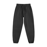Unisex Vintage Washed Cotton Sweatpants in black with elastic waistband and drawstring, ideal for casual streetwear or lounging.