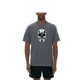 Mark the Believer Tee in grey worn by male model, featuring a bold skull graphic on front. Unisex seamless t-shirt made from 100% cotton.