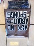 Textured fabric with printed text on a tiled floor background