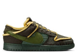 Green and brown sneaker with a distinctive logo on a white background