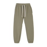 Olive green Essential Fleece Sweatpants with side pockets and elastic waistband, combining flexibility and style for all-day wear.