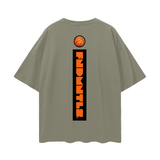 Back of olive green FNDMNTLS. Shattered Tee featuring vertical logo and basketball design, oversized cotton tee for streetwear lovers.
