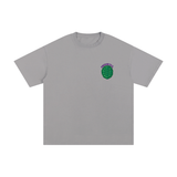 Unisex Cotton T-Shirt – Turtle Power in grey with a green turtle shell graphic and 'TURTLE PWR' text on chest. Loose fit, 100% cotton fabric.