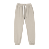 Light gray Essential Fleece Sweatpants with drawstring waist and elastic cuffs, perfect for unisex activewear and everyday comfort.