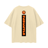 Rear of beige FNDMNTLS. Shattered Tee with vertical shattered logo and basketball graphic, oversized cotton tee for casual looks.