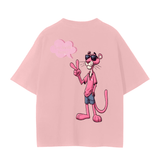 Back of pink FNDMNTLS. Pink Panther Unisex Seamless T-Shirt showing Pink Panther in casual outfit with peace sign and speech bubble.