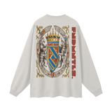 White long-sleeved shirt with heraldic crest design for the God Fndmntls Long Sleeve Crest Shirt collection