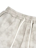 Gray tie-dye washed fleece sweatpants with a relaxed fit, ideal for casual wear