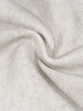 Wrinkled light gray dirty washed fleece fabric close-up for washed fleece sweatpants