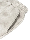 Washed fleece sweatpants with elastic waistband and side pocket in gray tie-dye pattern
