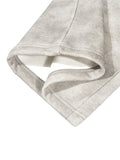 Gray fabric sleeve cuff on washed fleece sweatpants in dirty washed fleece finish