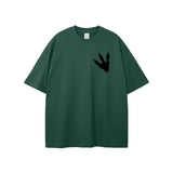 Dark green Jurassic Park footprint graphic t-shirt with loose fit and round neck, 100% cotton breathable fabric, unisex streetwear style.