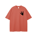 Unisex loose fit graphic t-shirt in terracotta with black Jurassic Park footprint print on chest, made of breathable 100% cotton.
