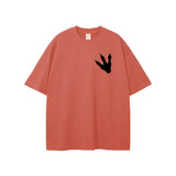 Unisex loose fit graphic t-shirt in terracotta with black Jurassic Park footprint print on chest, made of breathable 100% cotton.