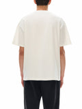 Back view of a person wearing a loose fit white graphic t-shirt made of 100% cotton with short sleeves and a classic round neck.