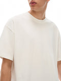 Unisex loose fit white cotton graphic t-shirt with Jurassic Park footprint print, breathable and casual streetwear style.