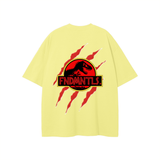 Yellow FNDMNTLS Jurassic Park graphic t-shirt with red claw marks and dinosaur logo on back, loose fit cotton tee