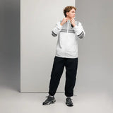Man in white and black athletic wear with breathable mesh lining for Ferrari Boys water-resistant fabric