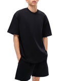 Black oversized T-shirt and shorts set featuring Prizm Logo Graphic design in inches
