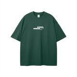 Green T-shirt with white text from Angel Wings Fndmntls Wings Fndmntls Graphic collection