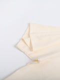 Close-up of sleeve stitching on beige Mark the Believer Tee. High-quality seamless cotton construction for daily comfort.