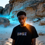 Black Kobe Cartoon Cotton T-Shirt with colorful 'KOBE' graphic on front. Pure cotton unisex tee for casual and festive wear.
