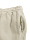 Detail of side pocket on beige Vintage Washed Cotton Sweatpants, highlighting practical design for casual streetwear.