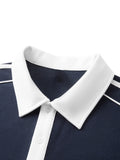 Close-up of the white contrast collar on navy short-sleeve polo shirt, showcasing button placket and stitching detail.