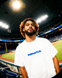 Close-up of Mets Blue T-Shirt - Heavyweight Earth Tone in white with blue FNDMTLS logo. Unisex cotton tee for casual streetwear.