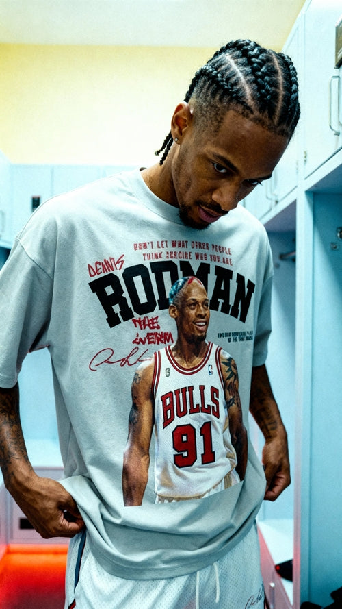 Person wearing a t-shirt with a graphic of a basketball player and text