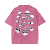 Nephilim Oversize Snow Wash black graphic tee with multiple skull prints on a faded pink cotton fabric, loose fit and drop shoulder design.