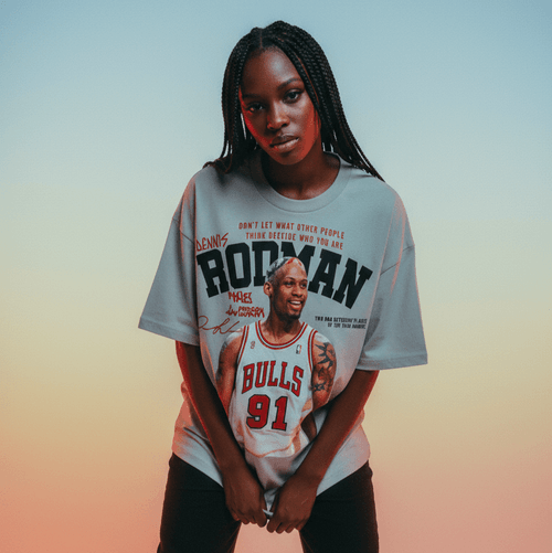 Person wearing a t-shirt with a basketball player's name and number on a gradient background